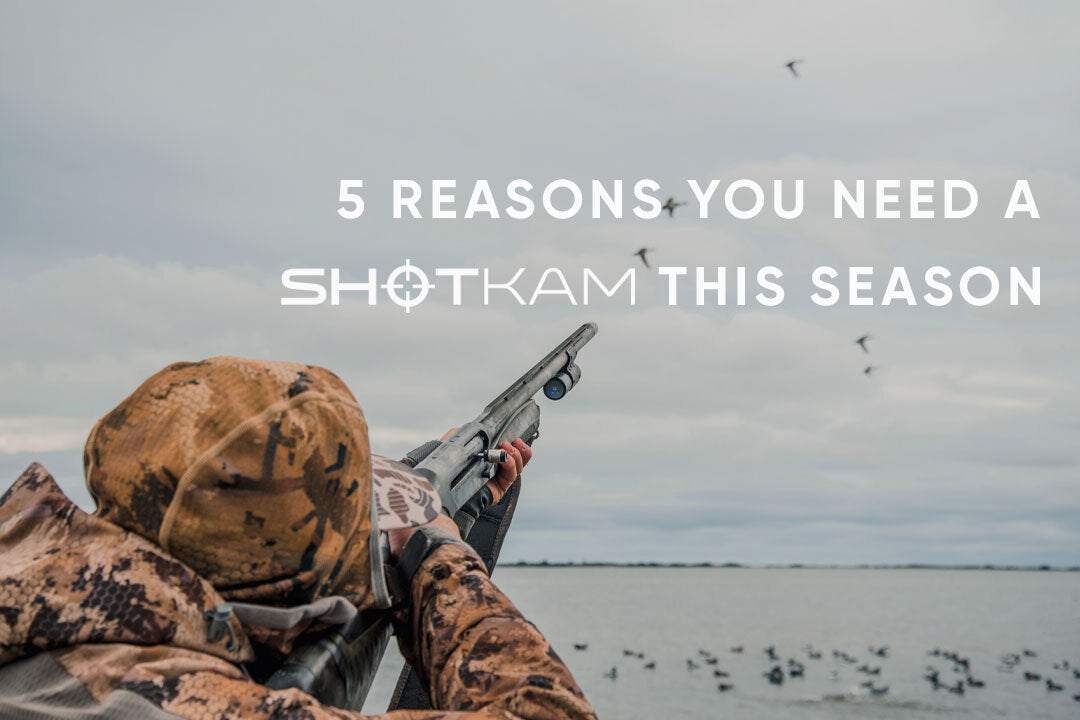 Waterfowl hunting at the lake, shotgun equipped with ShotKam aimed skyward at flying ducks.