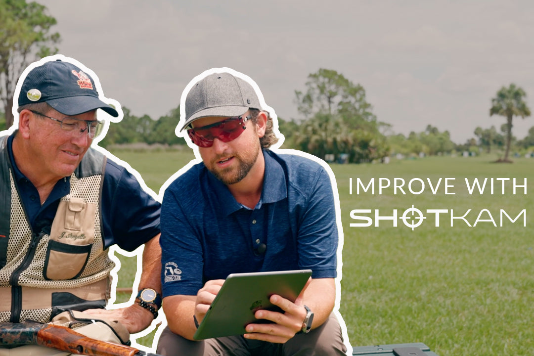 Shooting secrets in Canada: Hunters analyzing ShotKam video on a tablet, sharing five tips for enhancing shooting skills.