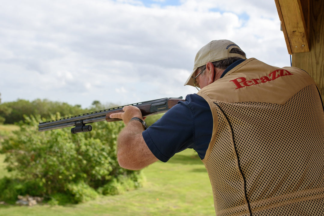 Canadian clay shooter prepares to take on rabbit targets with a shotgun, highlighting effective shooting methods.
