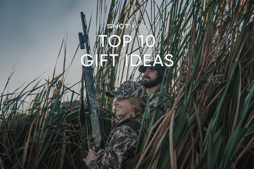 Canadian couple dressed in camouflage hunting gear, featured in ShotKam’s top 10 Valentine’s Day gifts for outdoor enthusiasts.