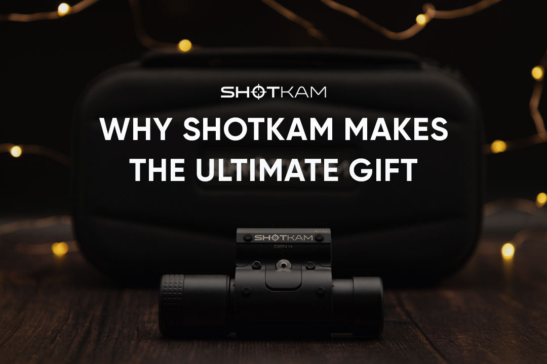 ShotKam shooting camera resting in front of its protective case, photographed with soft golden holiday lighting.