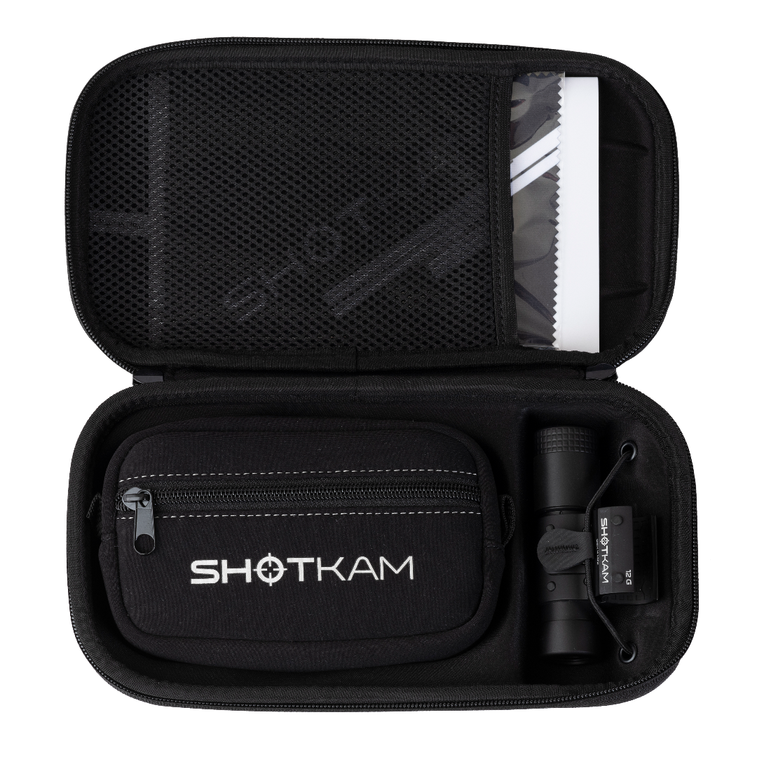 ShotKam Gen 4 Mini neatly stored in a black carrying case, showing its organized compartments for camera and accessories.