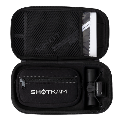 ShotKam Gen 4 Mini neatly stored in a black carrying case, showing its organized compartments for camera and accessories.